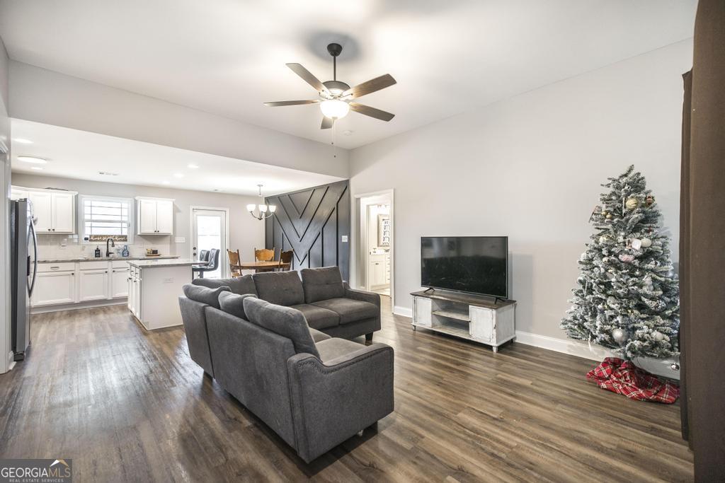 137 Sadie Heights Boulevard Perry, GA 31069 - Photo 4 of 25 a living room with furniture and a flat screen tv