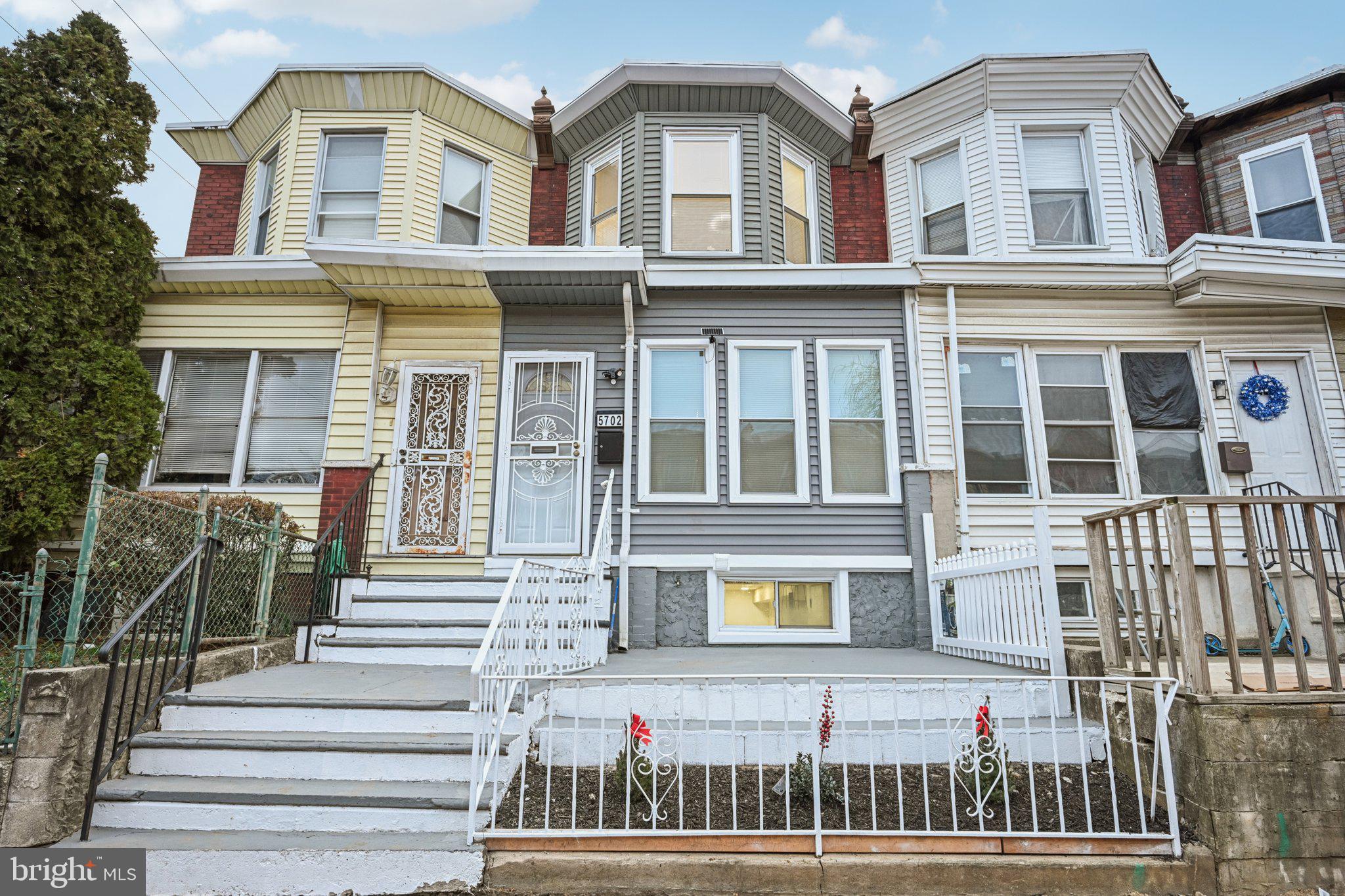 5702 Belmar Street Philadelphia, PA 19143 - Photo 1 of 29 a front view of a house with a porch