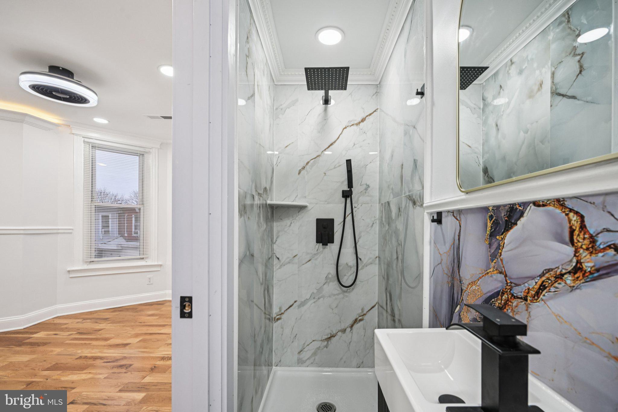 5702 Belmar Street Philadelphia, PA 19143 - Photo 15 of 29 a bathroom with a shower and a toilet
