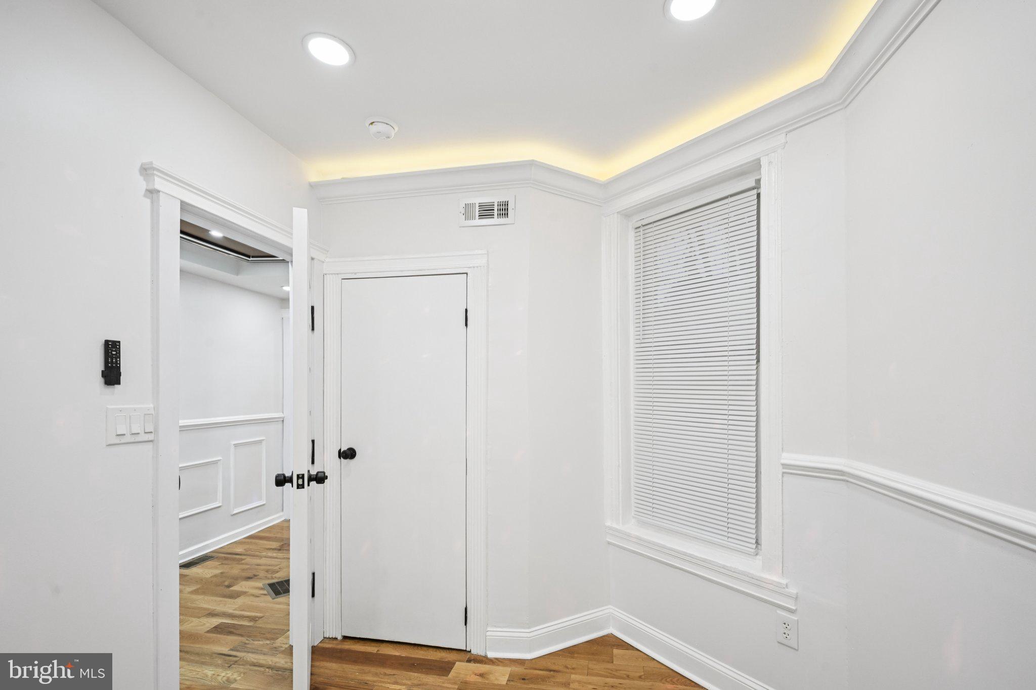 5702 Belmar Street Philadelphia, PA 19143 - Photo 16 of 29 a view of walk in closet with empty racks