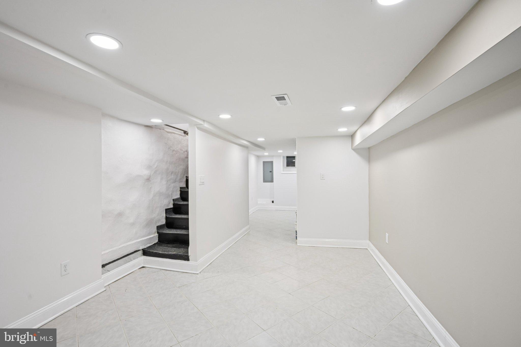 5702 Belmar Street Philadelphia, PA 19143 - Photo 22 of 29 wooden floor in an empty room