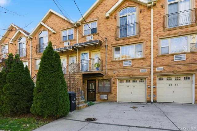 a kitchen with stainless steel appliances kitchen island granite countertop a stove top oven a sink dishwasher a dining table and chairs with wooden floor