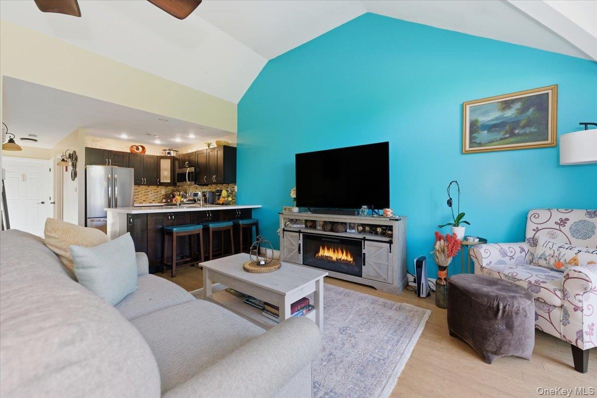 2853 Ely Avenue, Unit 3 Bronx, NY 10469 - Photo 4 of 20 a living room with furniture and a flat screen tv