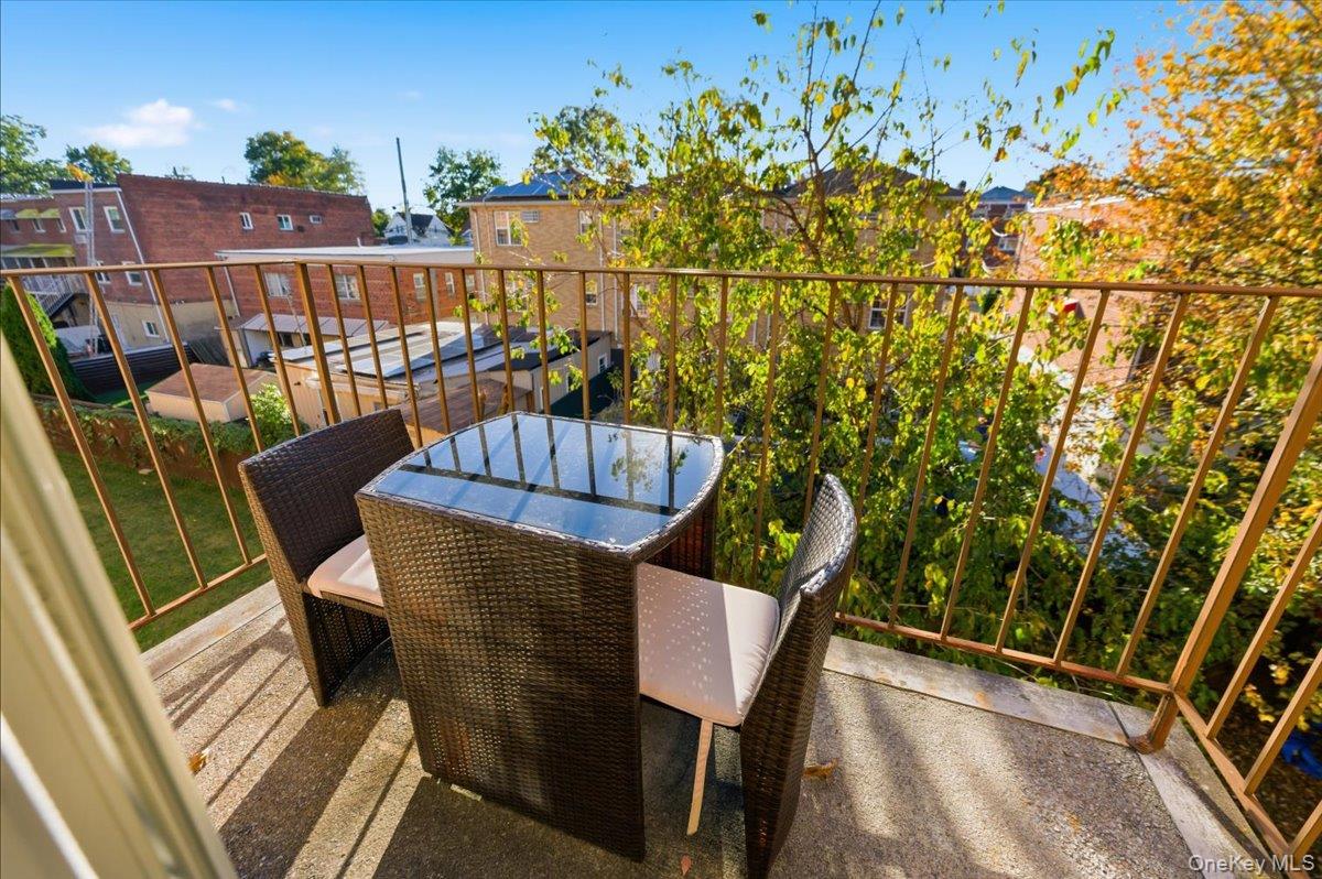2853 Ely Avenue, Unit 3 Bronx, NY 10469 - Photo 8 of 20 a view of a chairs and table in the balcony
