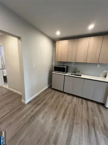 a view of kitchen with wooden floor
