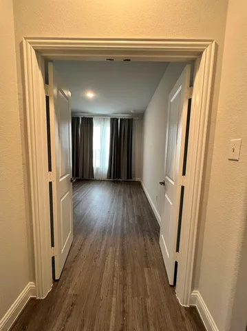 a view of gallery with wooden floor