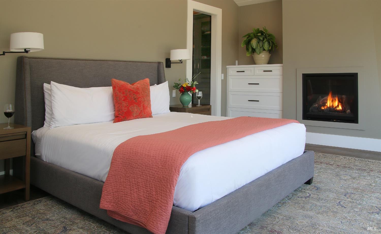 1531 Estee Avenue Napa, CA 94558 - Photo 18 of 49 a bed sitting in a bedroom next to a lamp next to a window and a fireplace