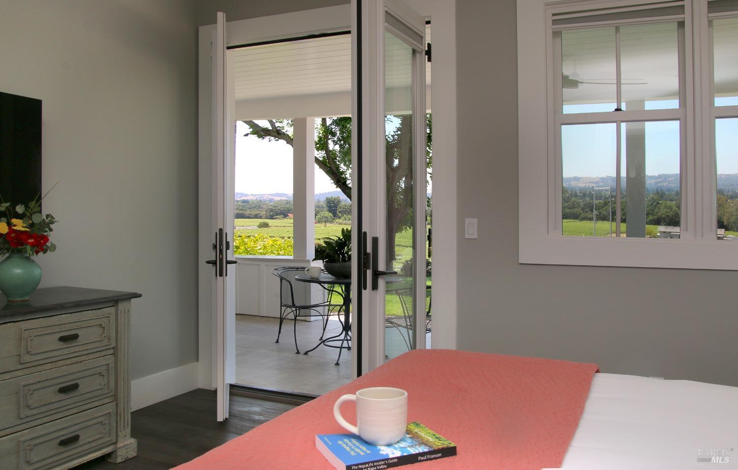 1531 Estee Avenue Napa, CA 94558 - Photo 23 of 49 a bedroom with a bed and large window with chair