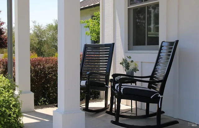 a view of a balcony with chairs