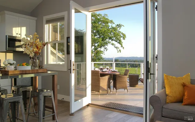 a view of living room with furniture and floor to ceiling window