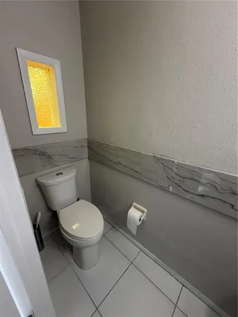 a bathroom with a toilet and a sink