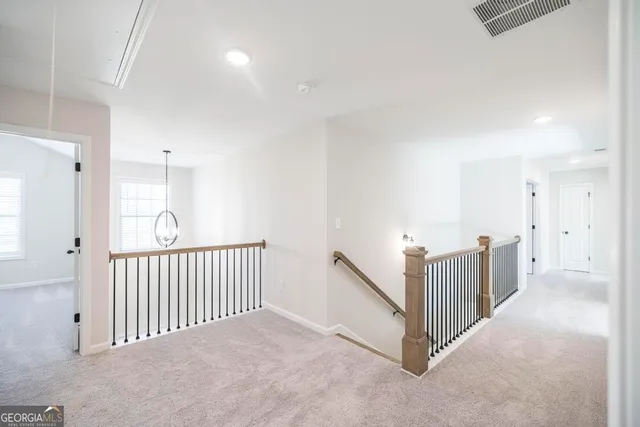 a view of a hallway with windows