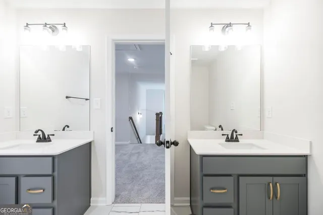 a bathroom with a sink vanity and a mirror