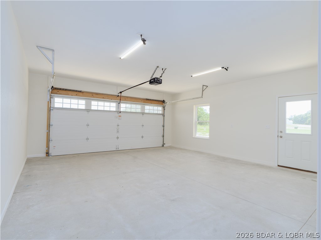 7 Oak Tree Lane Eldon, MO 65026 - Photo 40 of 59 2 car garage with side exit. Drywalled, painted, l