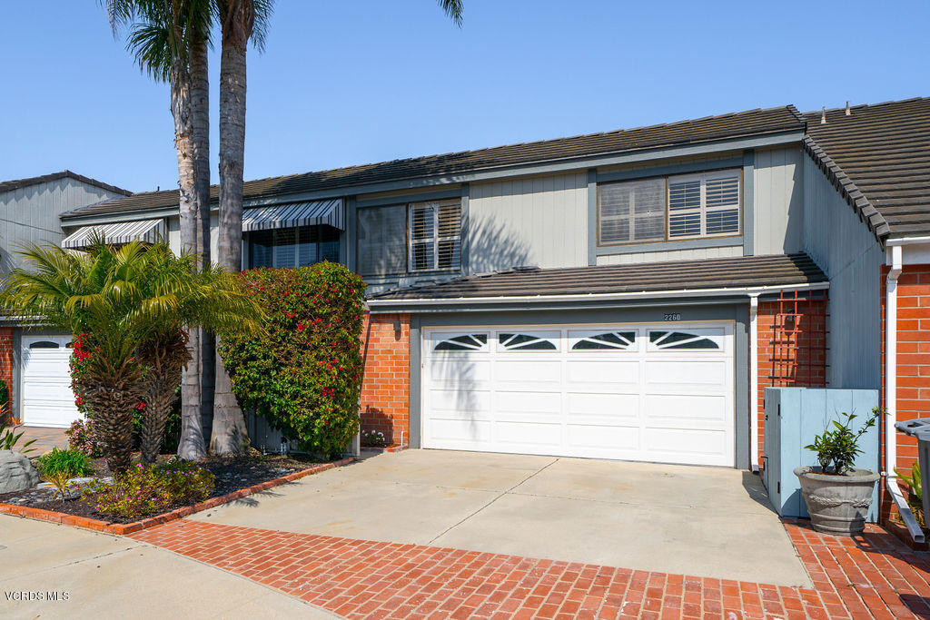 2260 Harbor Boulevard Oxnard, CA 93035 - Photo 1 of 28 a front view of a house with a yard and garage