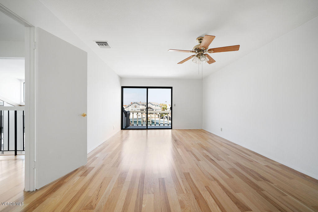 2260 Harbor Boulevard Oxnard, CA 93035 - Photo 19 of 28 wooden floor in an empty room with a window