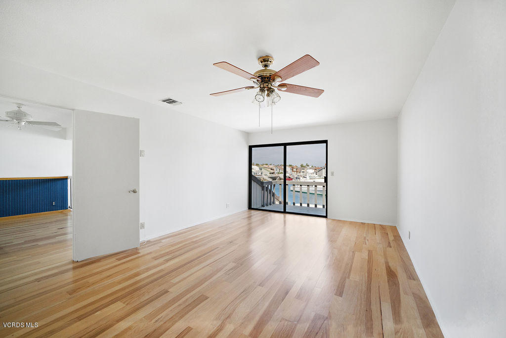 2260 Harbor Boulevard Oxnard, CA 93035 - Photo 20 of 28 a view of an empty room with window and wooden floor