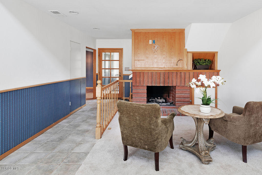 2260 Harbor Boulevard Oxnard, CA 93035 - Photo 6 of 28 a dining room with furniture a fireplace and wooden floor