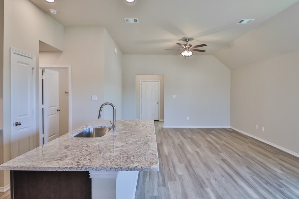 2871 Messenger Way Bryan, TX 77803 - Photo 2 of 13 a view of a kitchen counter space a sink and wooden floor