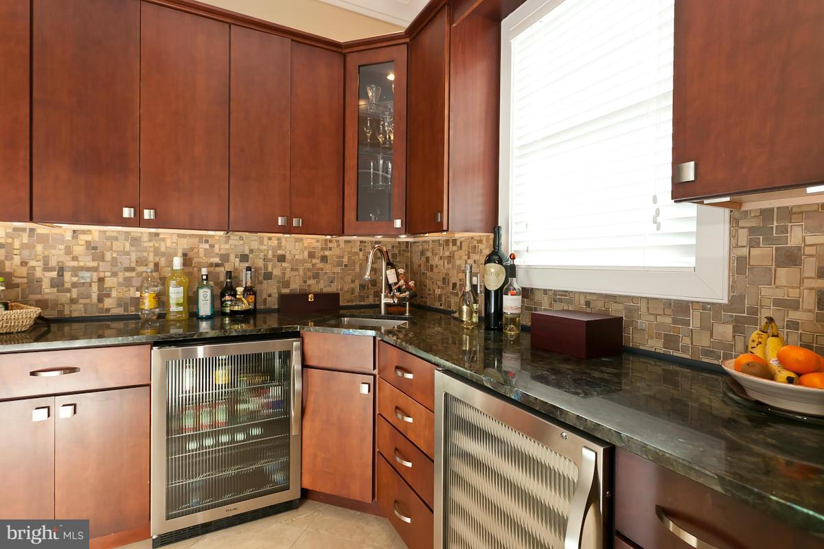 1712 Wilson Point Road Baltimore, MD 21220 - Photo 13 of 30 a kitchen with stainless steel appliances granite countertop a sink stove and cabinets