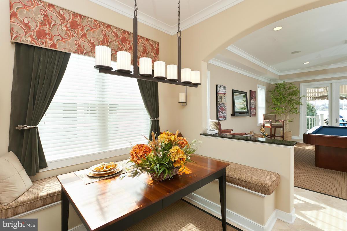 1712 Wilson Point Road Baltimore, MD 21220 - Photo 14 of 30 a living room with furniture and a table