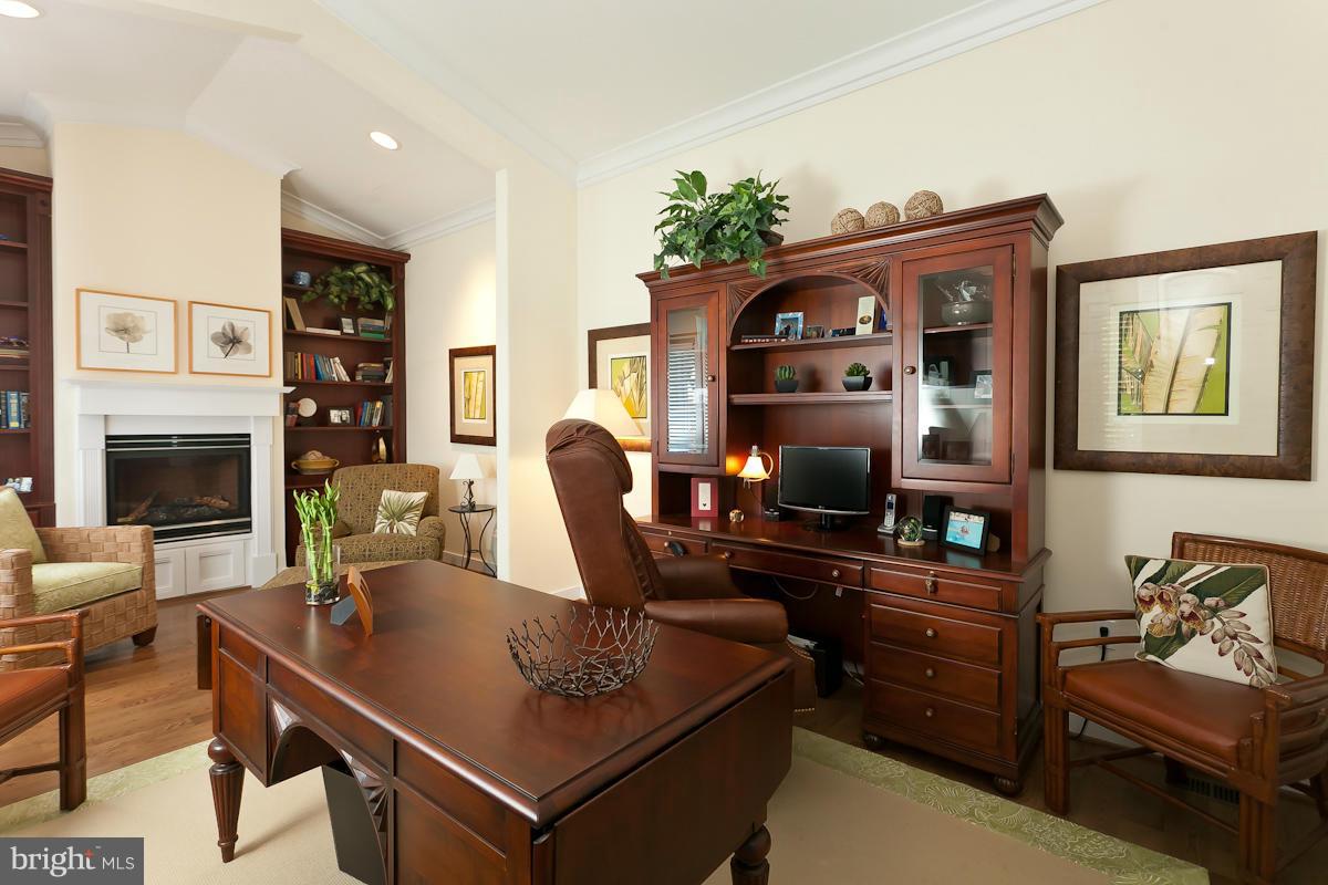 1712 Wilson Point Road Baltimore, MD 21220 - Photo 16 of 30 a work room with furniture and wooden floor