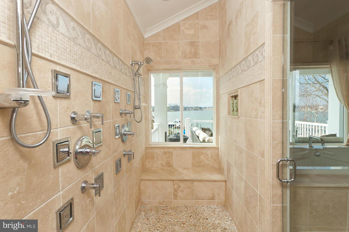 1712 Wilson Point Road Baltimore, MD 21220 - Photo 20 of 30 a bathroom with a granite countertop shower and a sink