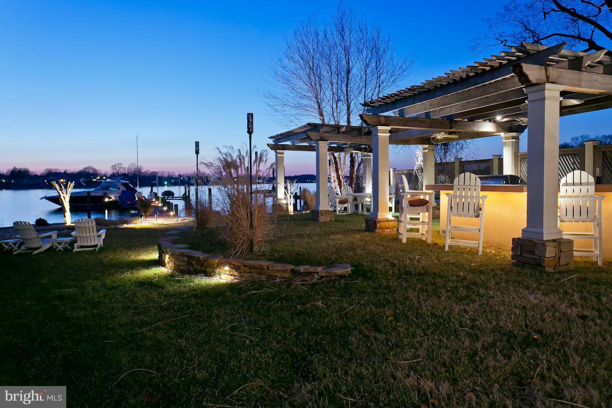 1712 Wilson Point Road Baltimore, MD 21220 - Photo 27 of 30 a view of a house with a backyard porch and sitting area