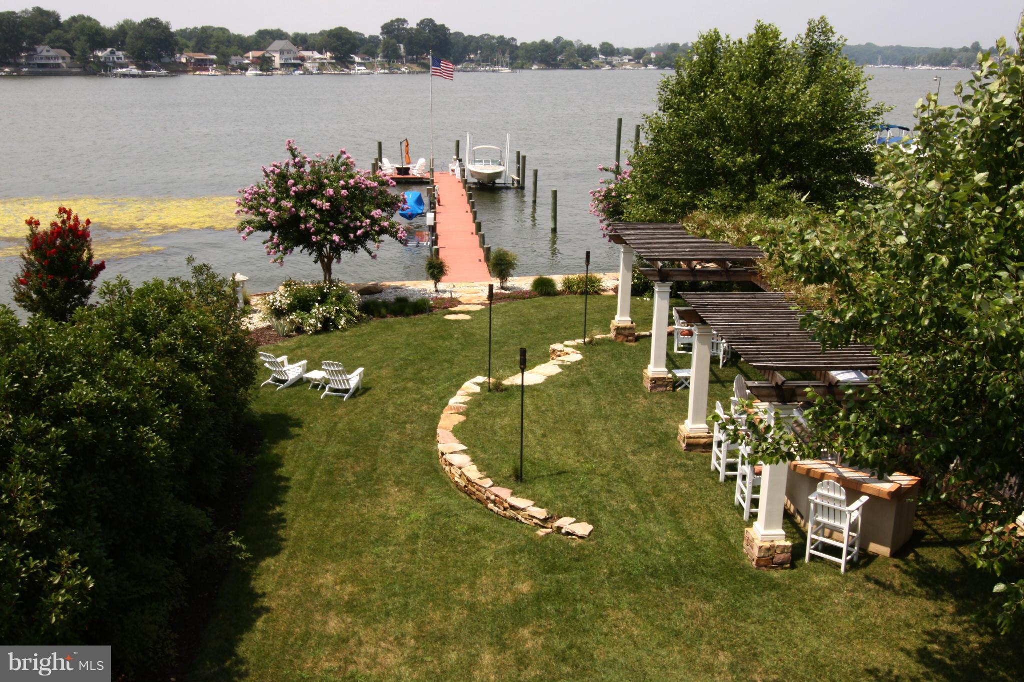 1712 Wilson Point Road Baltimore, MD 21220 - Photo 28 of 30 a view of a lake with houses with outdoor space