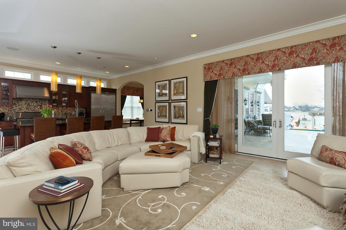 1712 Wilson Point Road Baltimore, MD 21220 - Photo 7 of 30 a living room with furniture and a large window