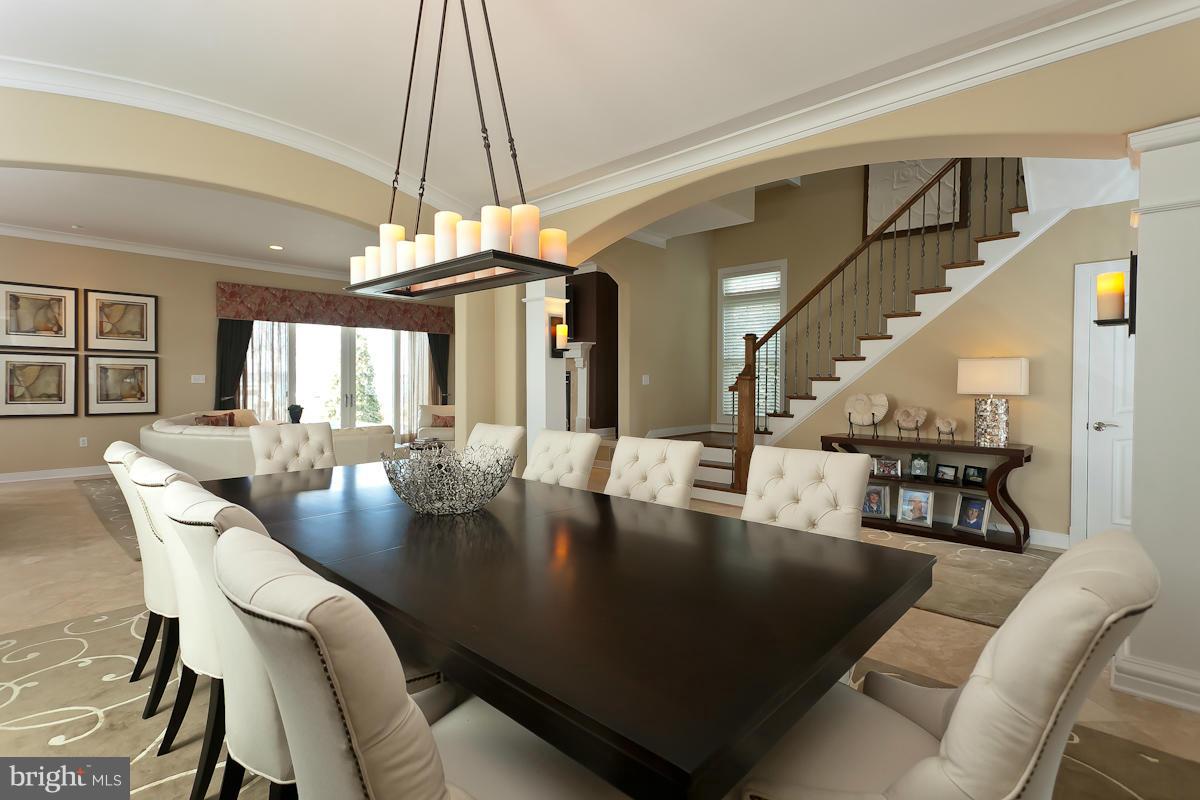 1712 Wilson Point Road Baltimore, MD 21220 - Photo 9 of 30 a view of a dining room with furniture and a chandelier