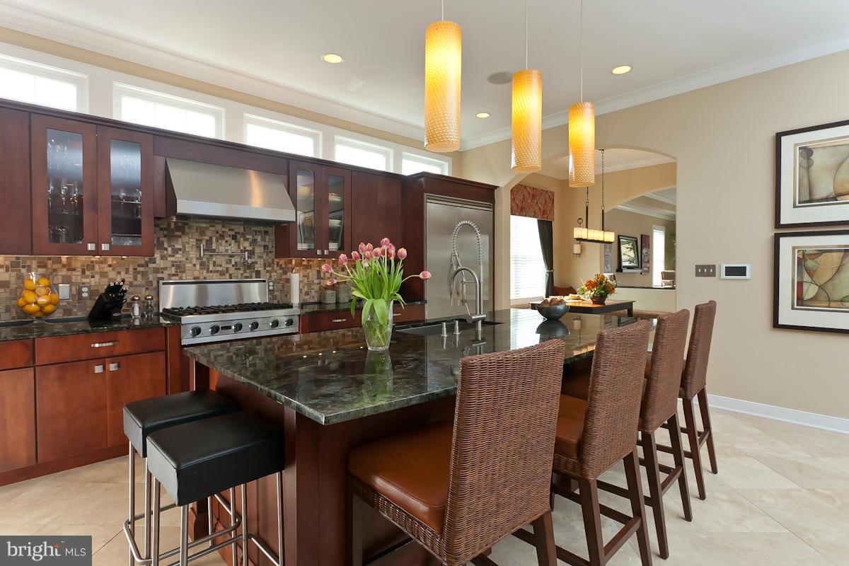 1712 Wilson Point Road Baltimore, MD 21220 - Photo 10 of 30 a kitchen with a table and chairs in it