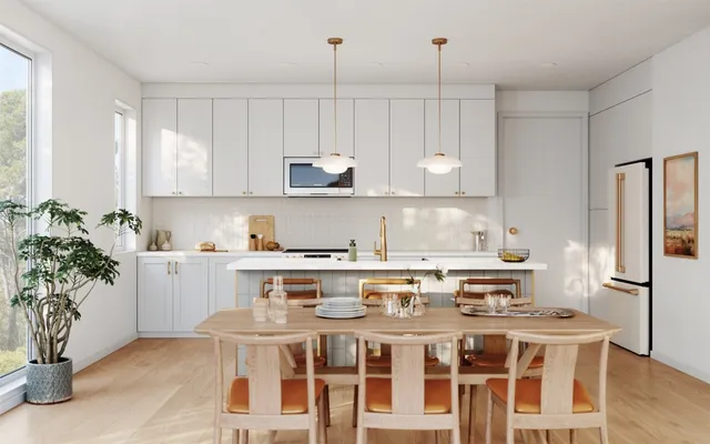 a kitchen with a stove a sink and cabinets
