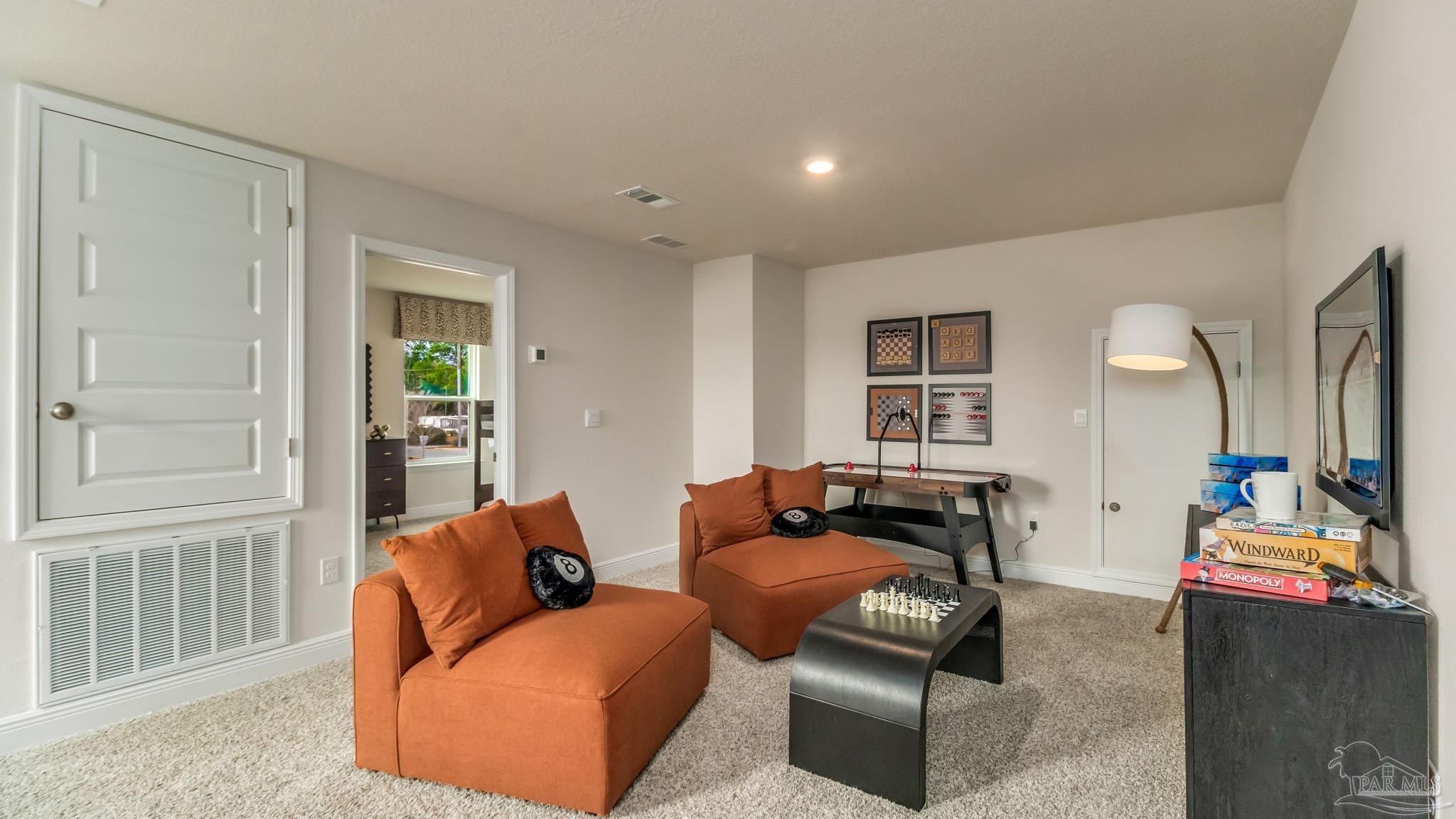 8717 Bluebell Street Milton, FL 32583 - Photo 21 of 30 a living room with furniture and a window