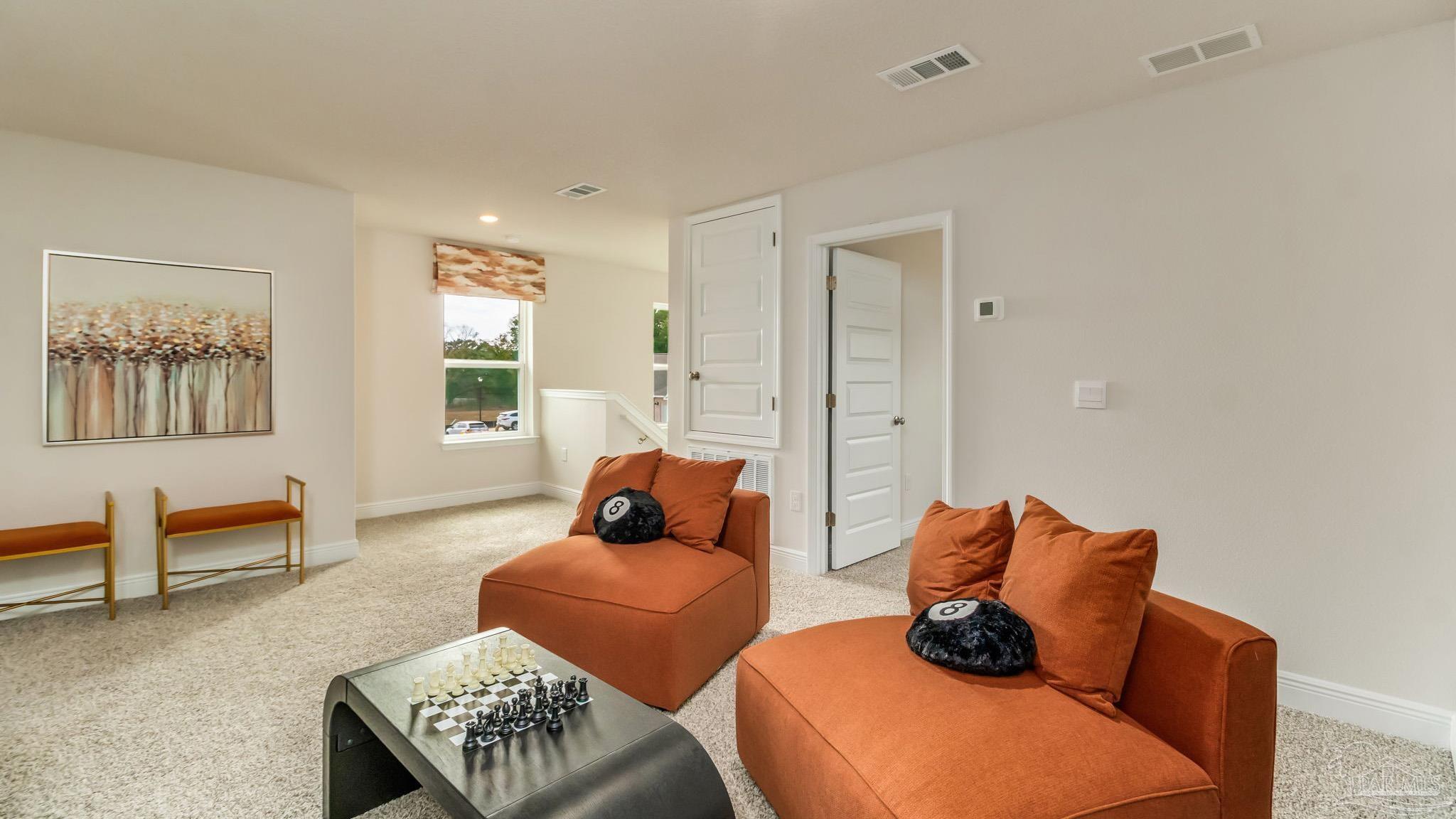 8717 Bluebell Street Milton, FL 32583 - Photo 23 of 30 a living room with furniture and a window