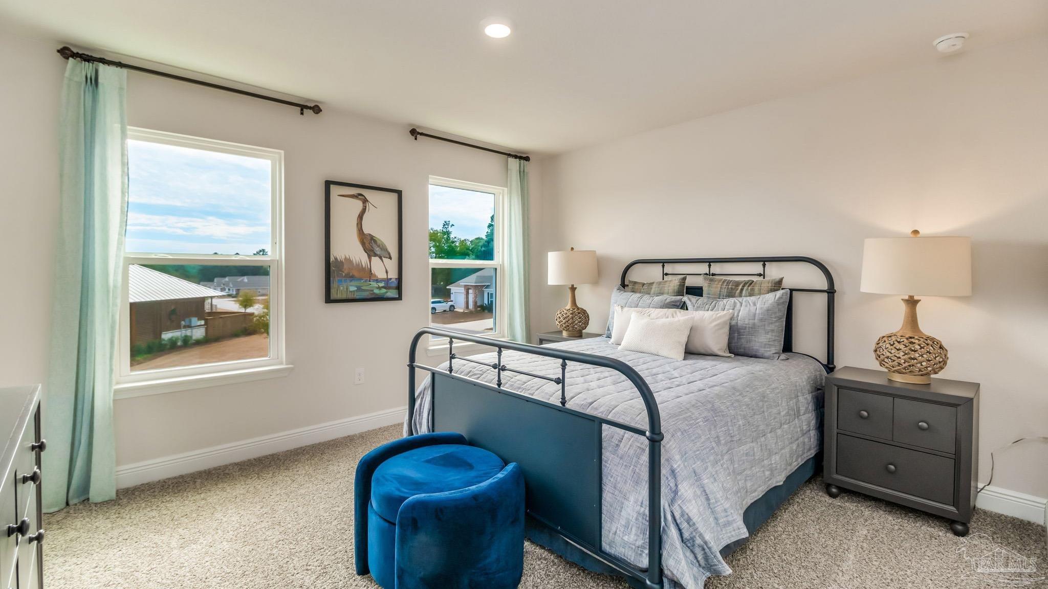 8717 Bluebell Street Milton, FL 32583 - Photo 25 of 30 a bedroom with a bed and window