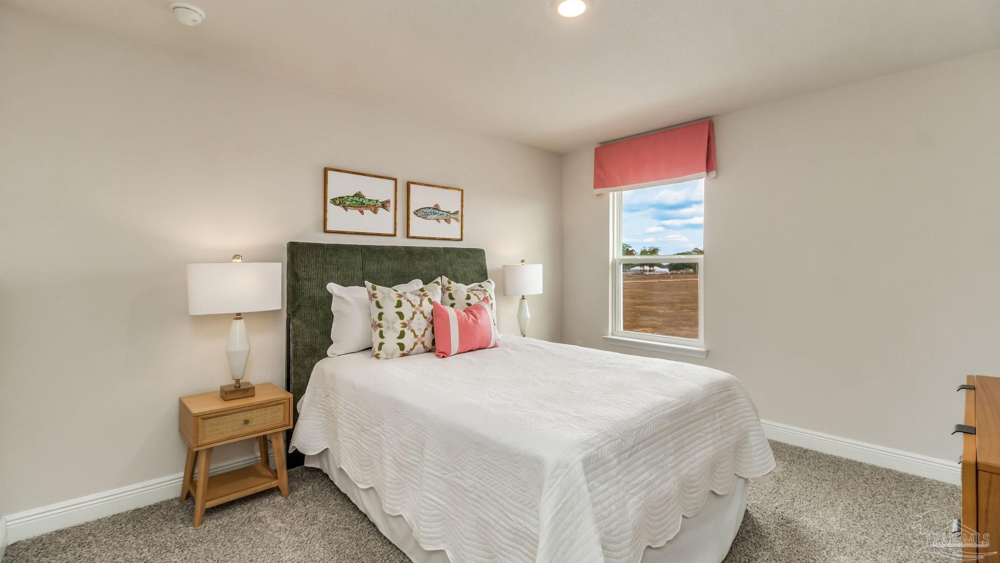 8717 Bluebell Street Milton, FL 32583 - Photo 27 of 30 a bedroom with a bed and a window