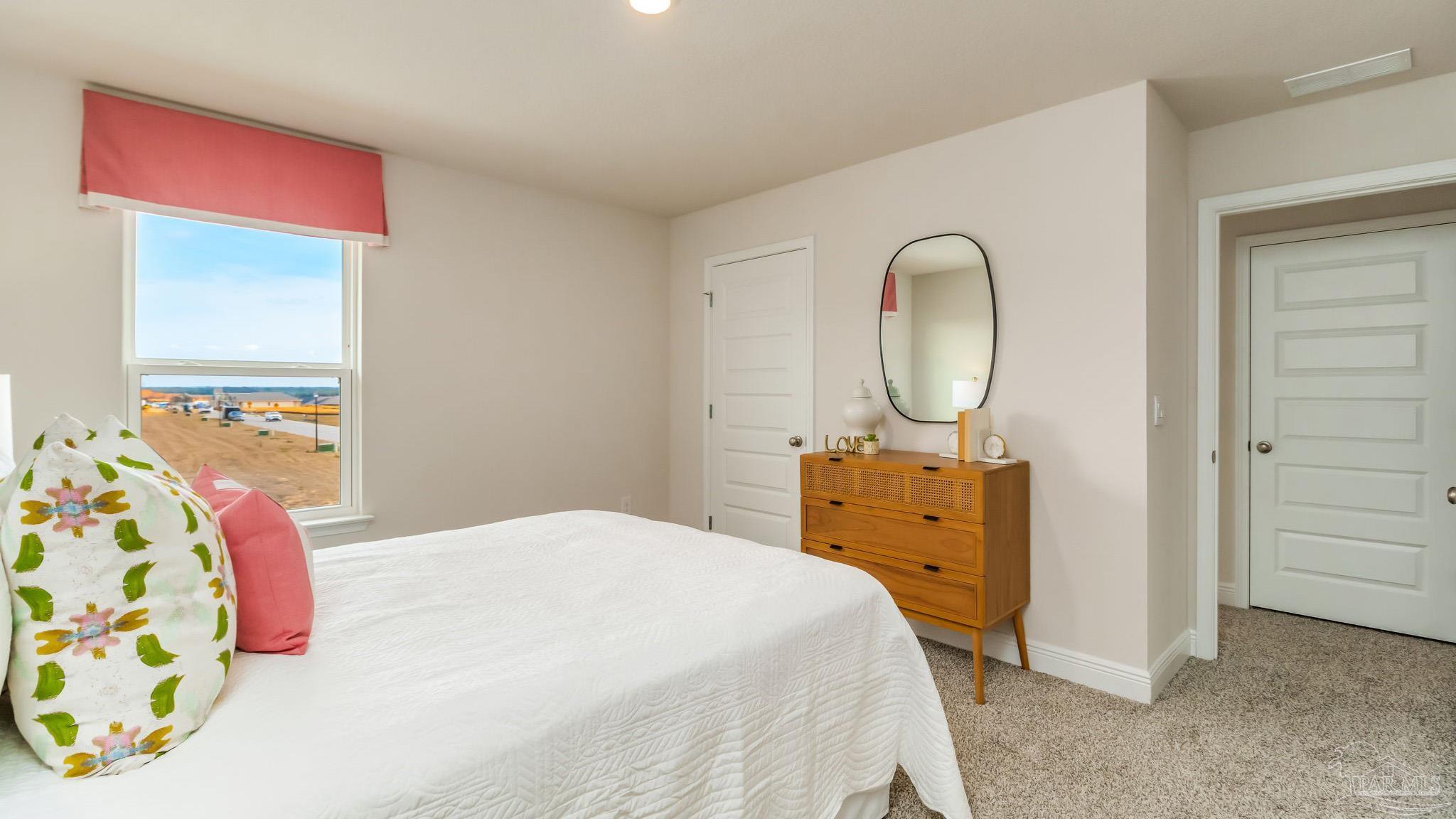 8717 Bluebell Street Milton, FL 32583 - Photo 28 of 30 a bedroom with a bed and a dresser