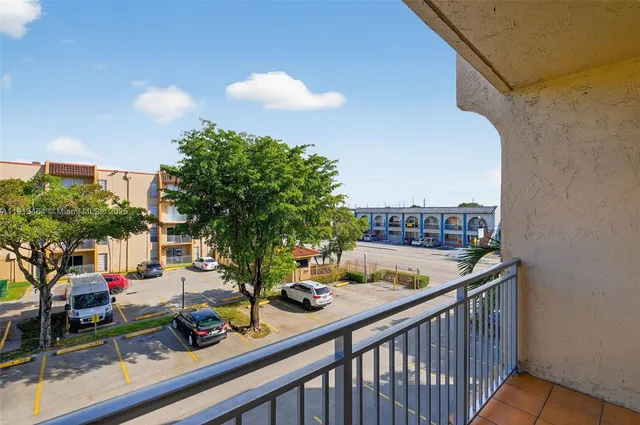 a view of a balcony dining table and chairs