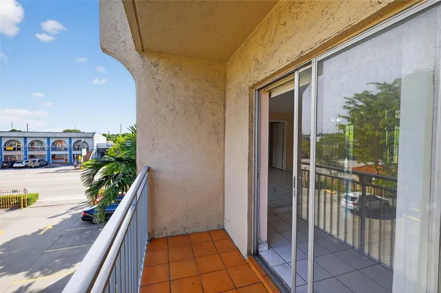a balcony with wooden floor