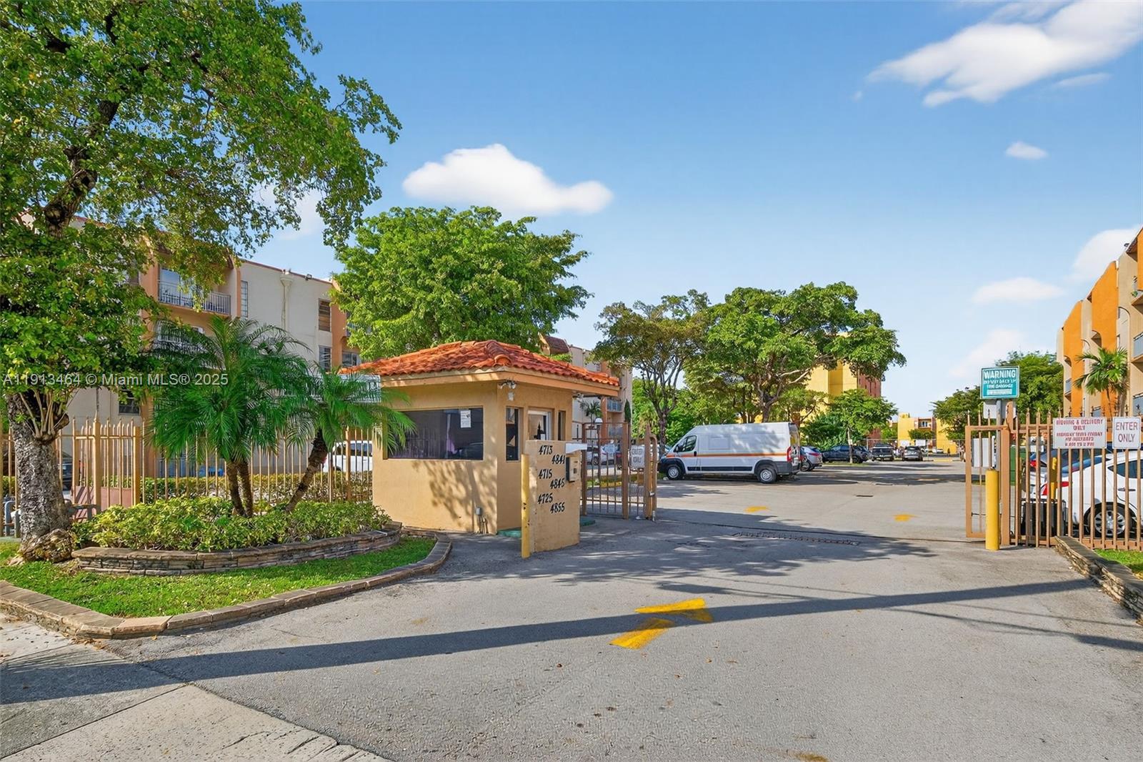 4841 Northwest 7th Street, Unit 3094 Miami, FL 33126 - Photo 33 of 33 a front view of a house with a yard and trees