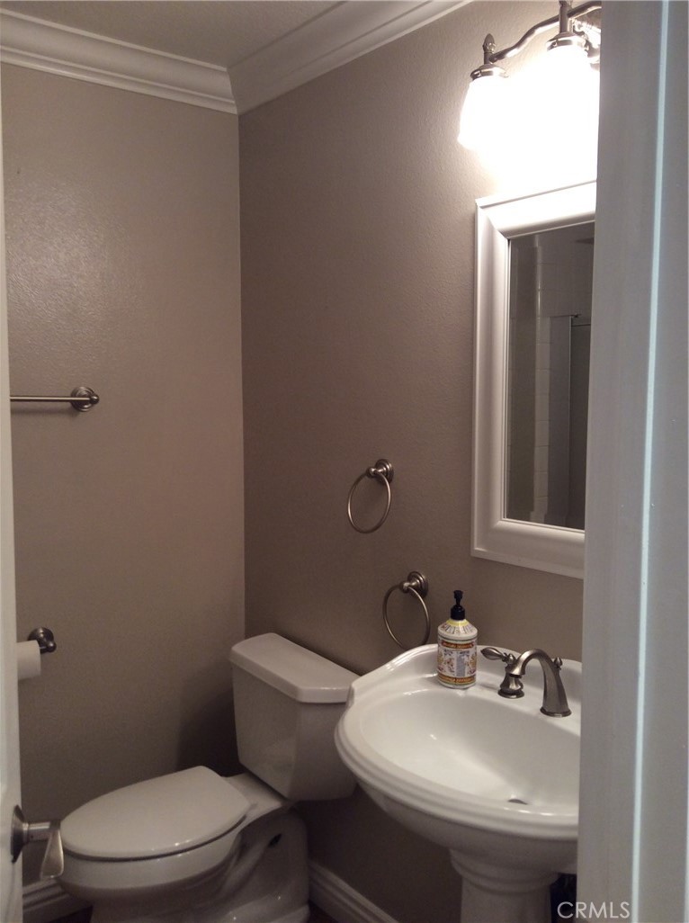 7 Mejorana Rancho Santa Margarita, CA 92688 - Photo 13 of 44 a bathroom with a sink mirror and toilet