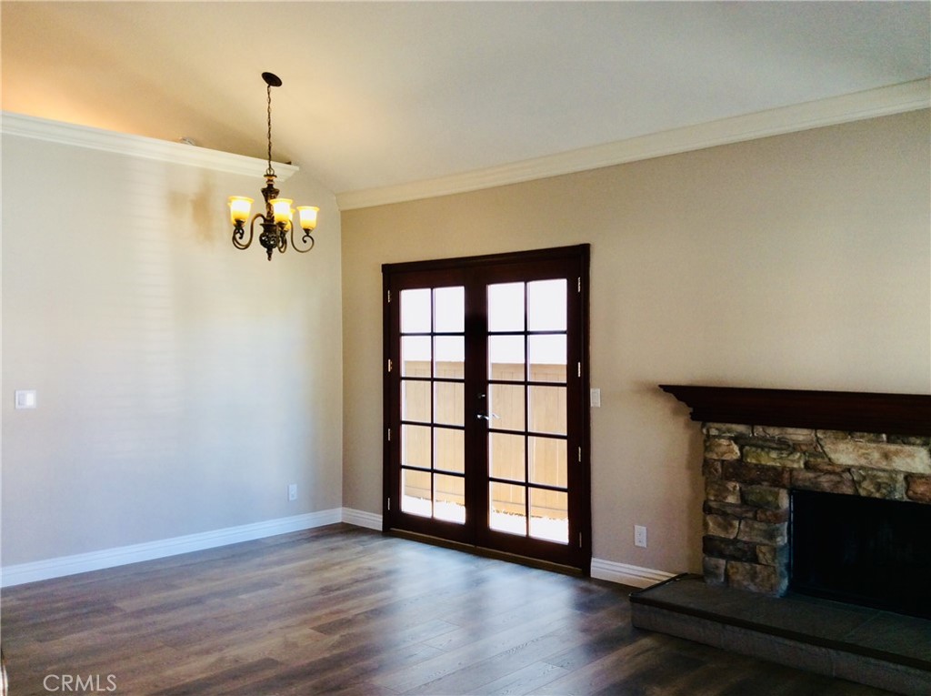 7 Mejorana Rancho Santa Margarita, CA 92688 - Photo 17 of 44 a view of a livingroom with wooden floor a fireplace and windows