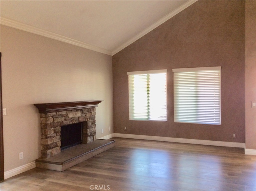 7 Mejorana Rancho Santa Margarita, CA 92688 - Photo 18 of 44 an empty room with wooden floor fireplace and windows