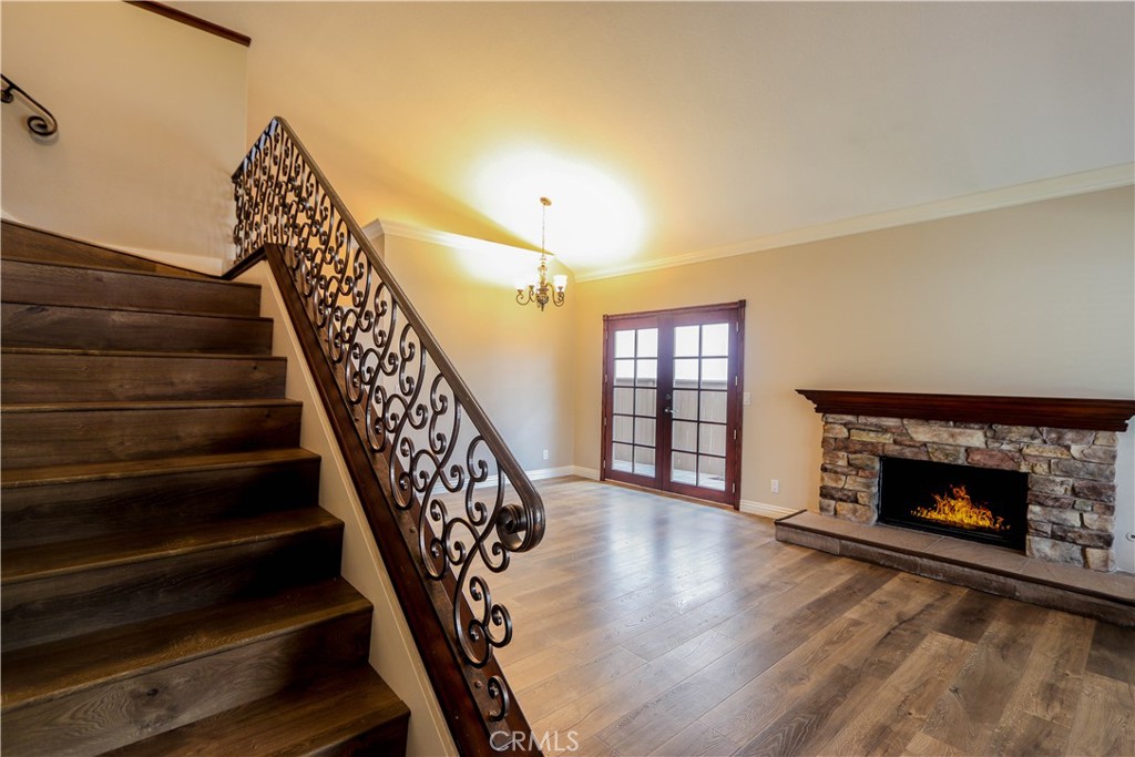 7 Mejorana Rancho Santa Margarita, CA 92688 - Photo 20 of 44 a view of an empty room with wooden floor fireplace and a window