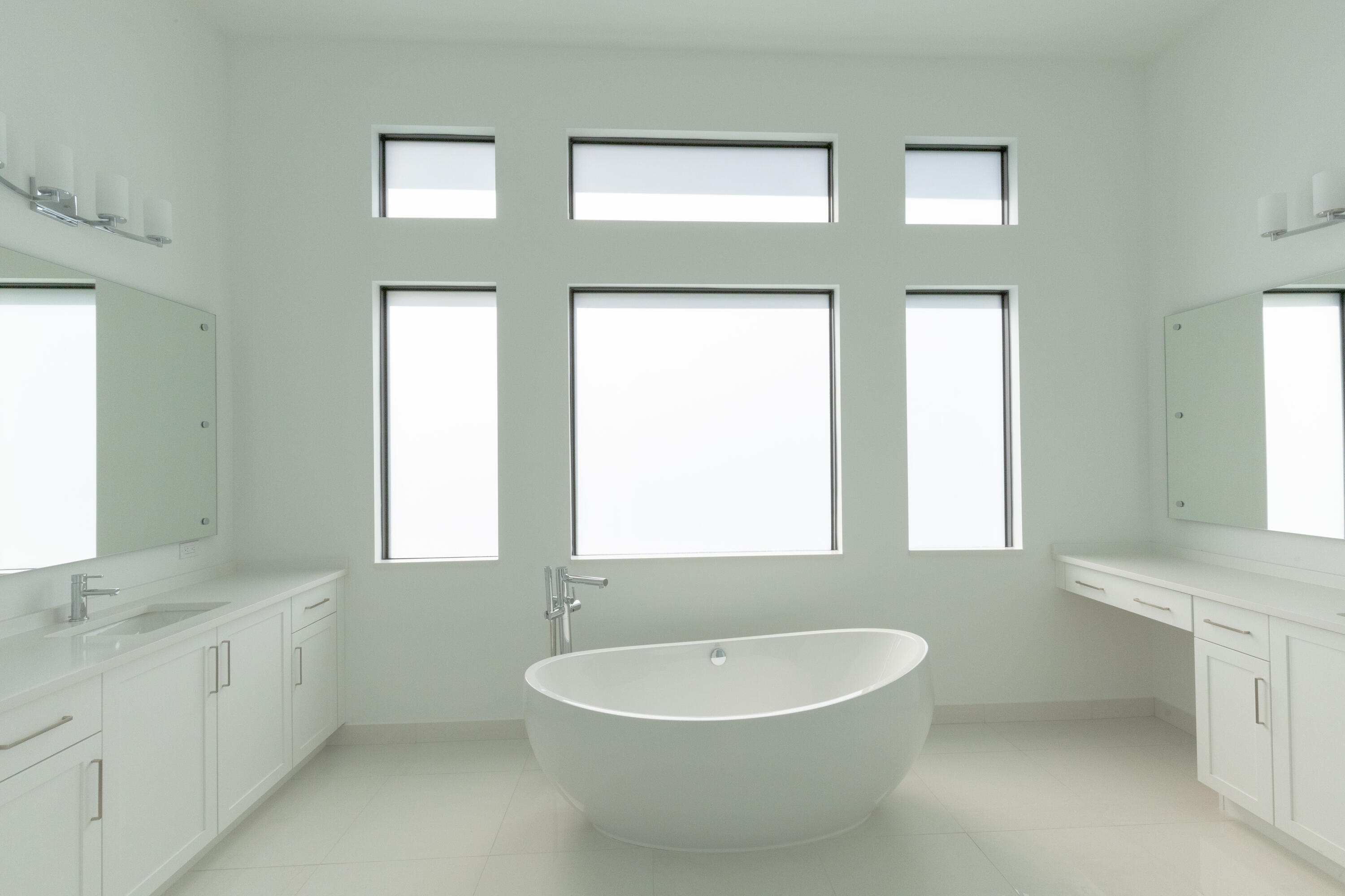 8252 Crystal Downs Avenue Boca Raton, FL 33434 - Photo 12 of 49 a bathroom with a bathtub a sink and a window