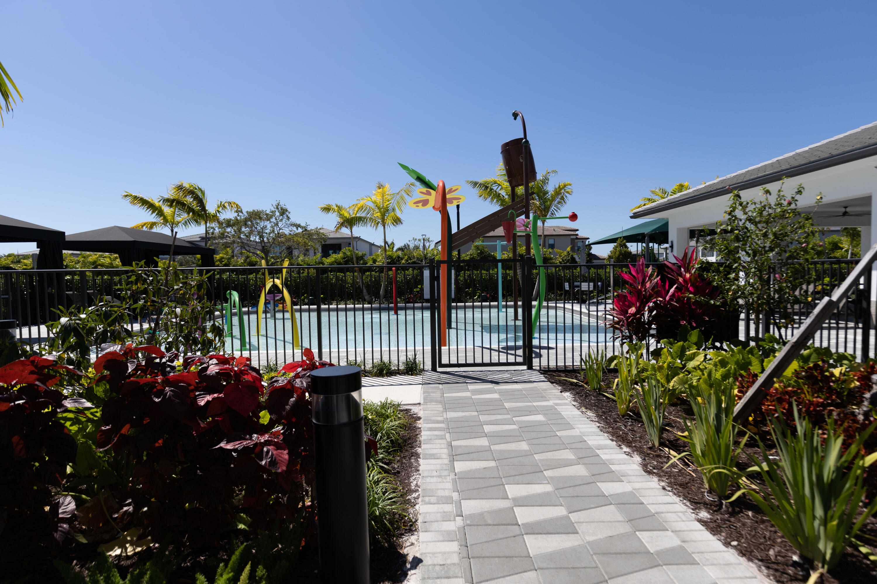 8252 Crystal Downs Avenue Boca Raton, FL 33434 - Photo 22 of 49 a view of a house with a flower garden