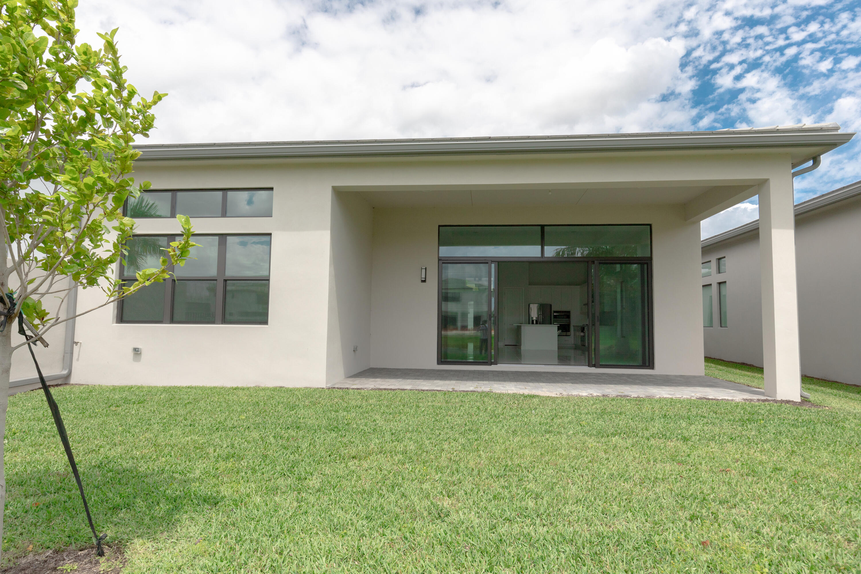 8252 Crystal Downs Avenue Boca Raton, FL 33434 - Photo 47 of 49 a front view of a house with a yard