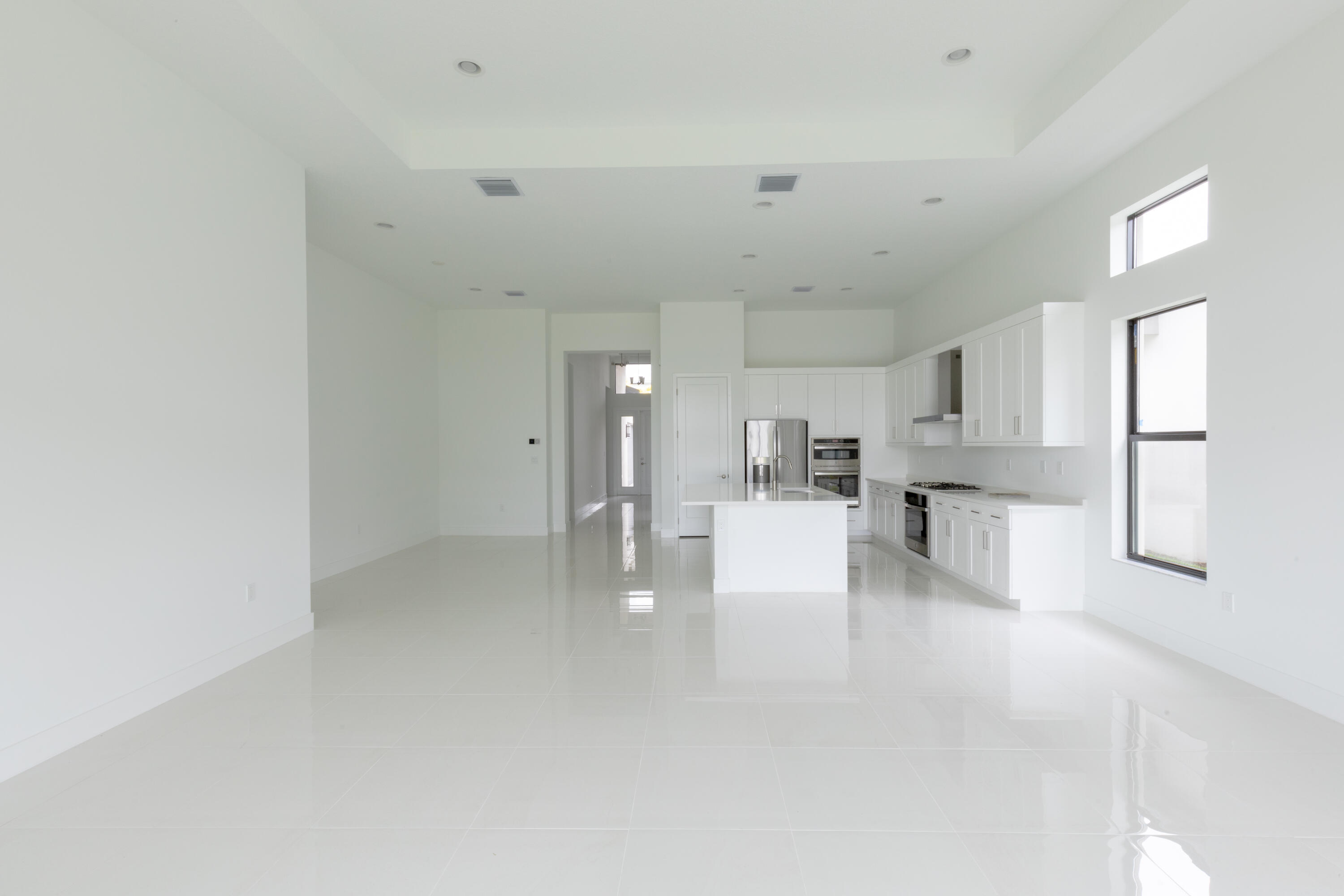 8252 Crystal Downs Avenue Boca Raton, FL 33434 - Photo 5 of 49 a view of kitchen and white cabinets