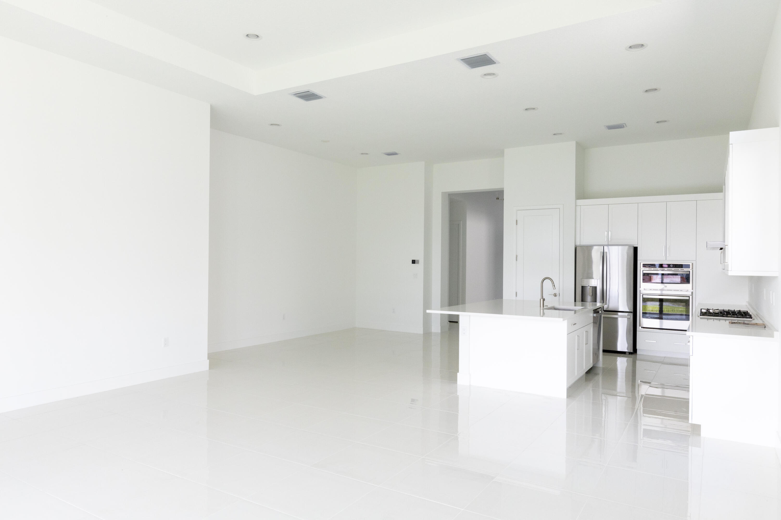 8252 Crystal Downs Avenue Boca Raton, FL 33434 - Photo 9 of 49 a view of kitchen with furniture and refrigerator